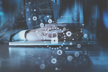 cyber security internet and networking concept.Businessman hand working with VR screen padlock icon on computer background