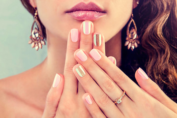 Beautiful woman showing her manicure