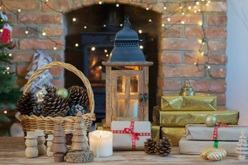 Christmas setting, lantern, decorated fireplace, fur tree