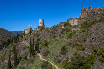 Fototapeta na wymiar ruins of Lastrous castle in France on top of the mountain on a sunny day with trees and path
