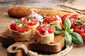 Bruschetta with tomatoes, herbs and oil on toasted garlic cheese bread toasted with chopped tomatoe