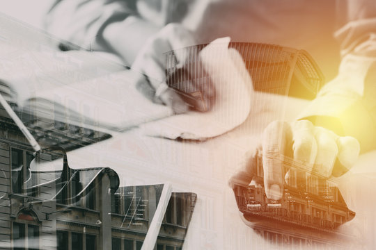 businessman hand working with finances about cost and calculator and latop with mobile phone on withe desk in modern office