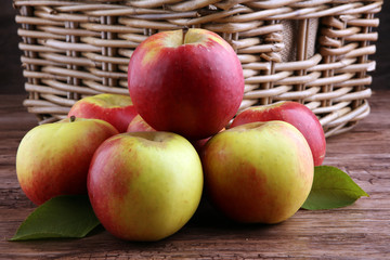 Ripe red apples on wooden background summer concept