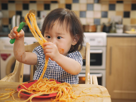 Baby Girl Eating Messy Spaghetti