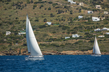 Ship yachts with white sails in the open Sea. Sailing. Luxury boats.