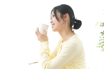 Woman drinking coffee at office