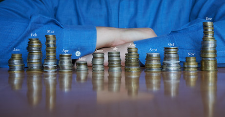 twelve stacks of coins on a desk