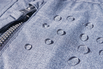 rain drops on waterproof clothing