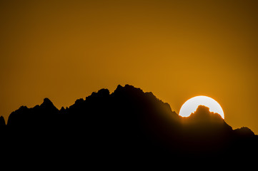 An incredible sunset behind the Sardinian mountains. Italy.