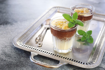 Pudding with vanilla custard, banana and cocoa