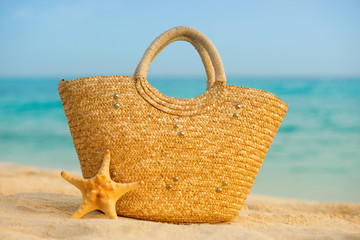 Fototapeta na wymiar Summer beach with accessories. Blur azure sea on background