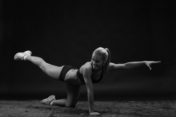 Fototapeta na wymiar Young beautiful sporty woman Fit sportswoman stretching