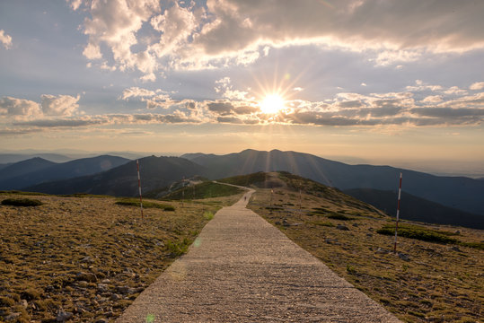Hikers walking on a mountain at sunset in Navacerrada, Madrid. Spain
