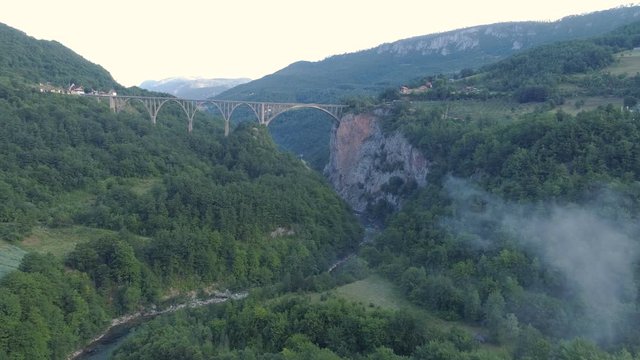 Aerial view of Durdevica Tara arc bridge in the mountains, One of the highest automobile bridges in Europe.