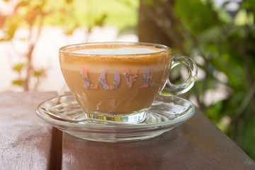 Cup of coffee on wood desk