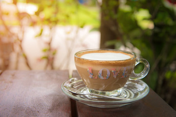 Cup of coffee on wood desk