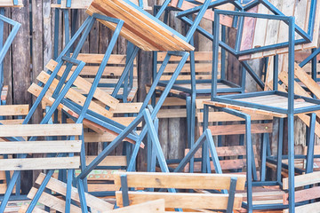 wooden chairs in random disarray