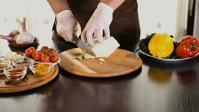 Chef slices green jalapeno hd