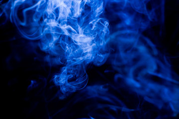 Blue toxic fumes movement on a black background.