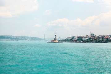 Obraz premium The lighthouse on the Bosporus between the Asian and European parts of Istanbul. On the right is the Asian part of the city, on the left is the European part. Landmark, navigation. Turkey.