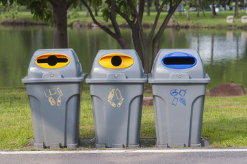Color trash containers for separate garbage in park.