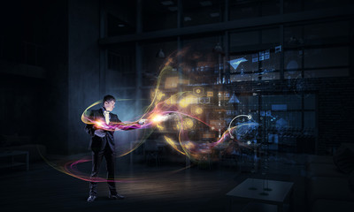 Businessman demonstrating magic . Mixed media