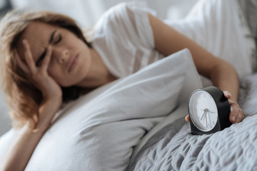 Modern alarm clock doing its morning job