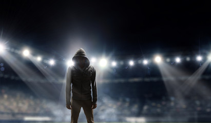 Silhouette of man in hoody