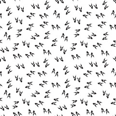 Minimal seamless pattern with dinosaur foots. Black and white colors. Vector illustration.