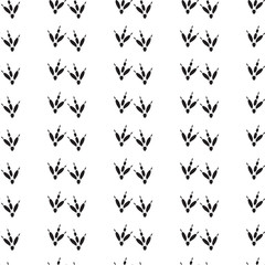 Minimal seamless pattern with dinosaur foots. Black and white colors. Vector illustration.