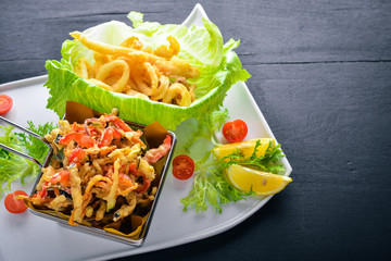 Seafood Grill. Italian cuisine. On a wooden background. Top view. Free space for your text.