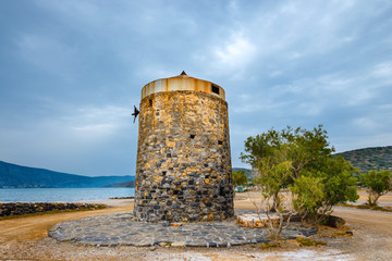Ancient windmill on Kalydon Peninsula near Agios Nikolaos, Crete, Greece
