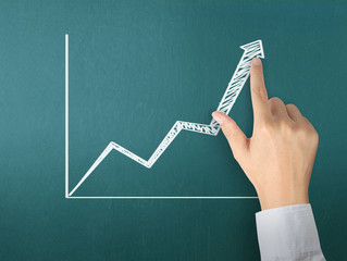 drawing  graph with white chalk on blackboard