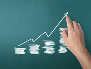 drawing  graph with white chalk on blackboard