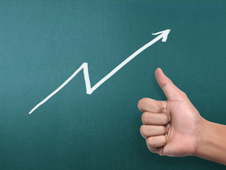 drawing  graph with white chalk on blackboard