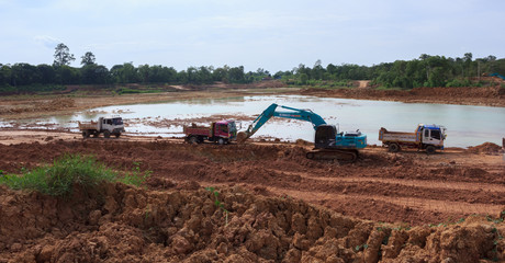 Backhoe're dredging the pond to store water for use during the dry season.