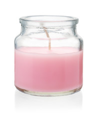 Pink homemade candle in glass jar