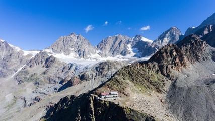 Fototapeta na wymiar Alpine refuge in high mountain - Tourism in Valtellina - Marinelli Bombardieri in Valmalenco