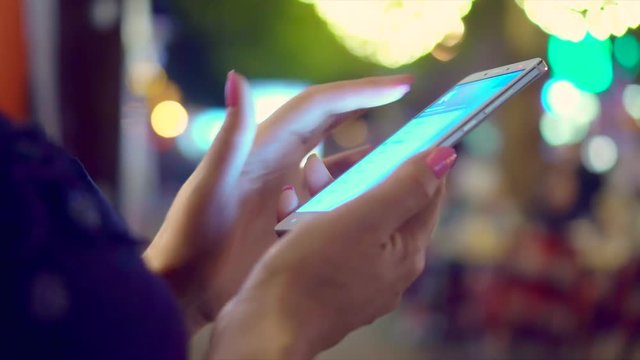 Close-Up Woman Using Smart-Phone In The City