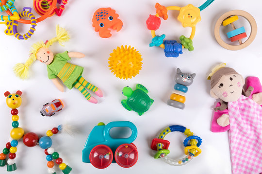 variety of colorful baby toys on white. top view