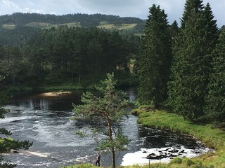 Man fishing in impressive Scandinavian scenery