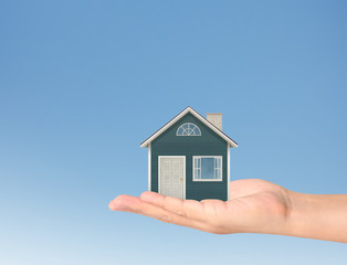 Fototapeta na wymiar Mortgage concept by house in hand