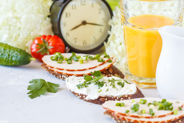 Sandwiches with ham and curd cheese for breakfast