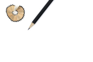 Pencil and pencil shavings on white background, copy space