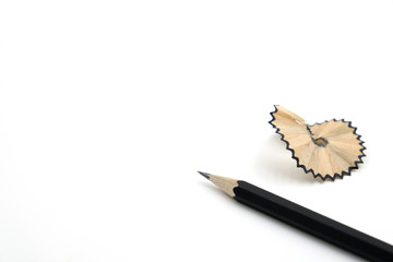 Pencil and pencil shavings on white background, copy space