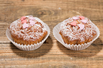 Cupcakes, muffins on a wooden table