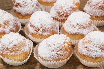 Cupcakes, muffins on a wooden table