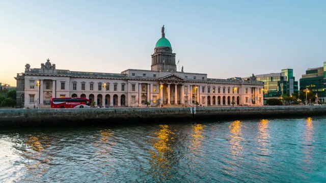 Dublin, Ireland. The Custom house in Dublin, Ireland in the evening. Time-lapse at sunset with illumination. Light to dark hyperlapse