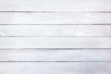 Obraz na płótnie Canvas A background of weathered white painted wood