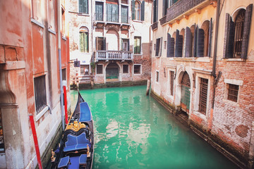 Fototapeta na wymiar Venice, Italy. Gondola on the canal on a sunny day.